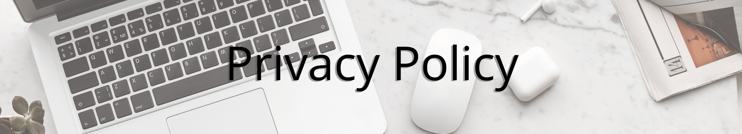 Privacy Policy Header - A computer laid out on the table with the words privacy policy overlaid on top.